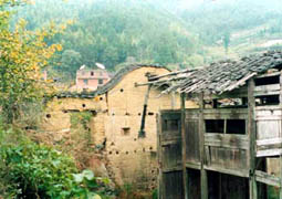 According to Grand Master Tham, this remote village which is up at the top of a hill is more than 500 years old. Look at some of the structures that constructed with only sand and mud. It was erected without cement or iron-bars at all. Master Tham and his master are there to studies its past and present Feng Shui.